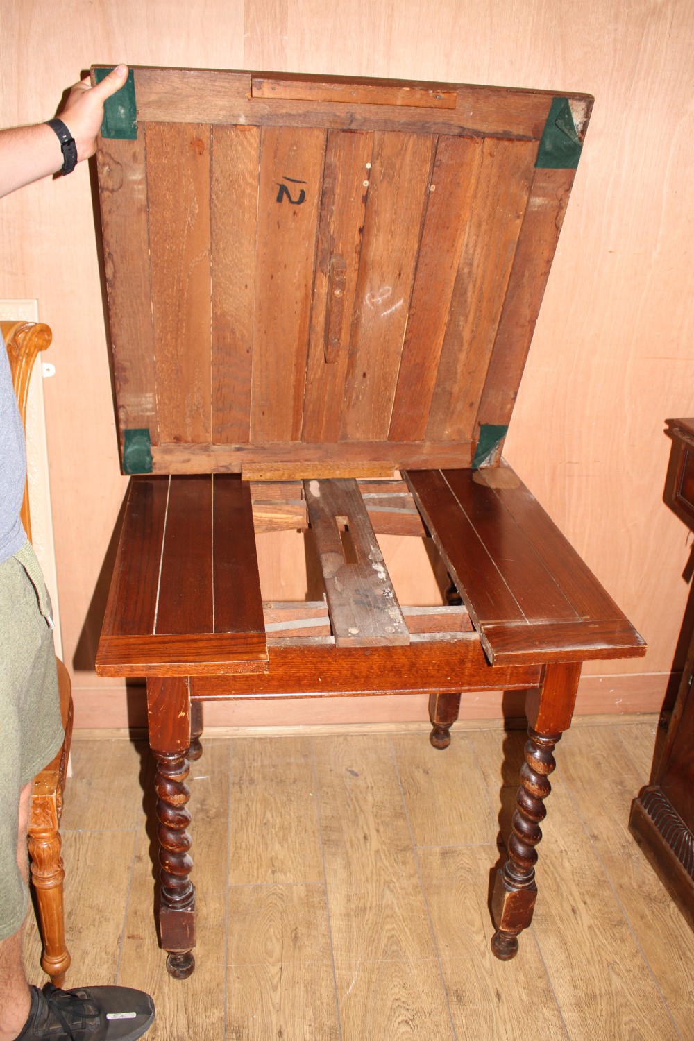 A 1920s oak draw leaf dining table, top 76cm sq. H.75cm